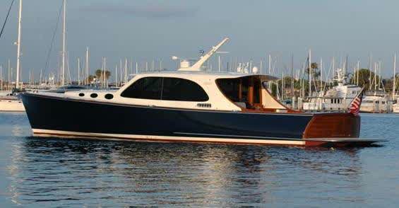 Navy Hinckley-style picnic boat, teak transom, American flag